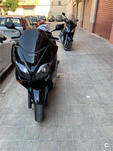  HONDA  forza  250  x 250  de color Negro del a o 2008 con 